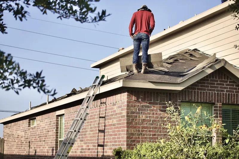Professional roofer working on a residential roof in San Jacinto